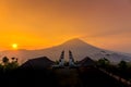 Beautiful sunset at Pura Lempuyang Luhur temple known as the Gates of Heaven with Mount Batur in background in Bali, Indonesia