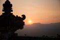 View from the Pura Lempuyang Temple, known as the Gates of Heaven, of the sun setting behind Mount Batur in Bali, Indonesia, Asia