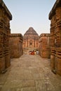 View of Sun temple between two intricately carved pillars in sandstone, Konark, India. Royalty Free Stock Photo