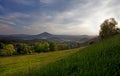 View of sunlit mountain landscape with meadows Royalty Free Stock Photo