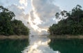 View of Sunrise with Reflection Between Two Island in Khao Sok National Park at Suratthani,Thailand from The Boat