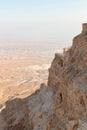 View  during sunrise from the ruins of the fortress wall of the fortress of Masada to the ruins of the palace of King Herod and to Royalty Free Stock Photo