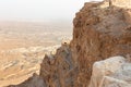 View  during sunrise from the ruins of the fortress wall of the fortress of Masada to the ruins of the palace of King Herod and to Royalty Free Stock Photo