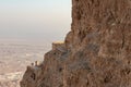 View during sunrise from the ruins of the fortress wall of the fortress of Masada to the ruins of the palace of King Herod and to