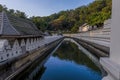 A view at sunset along the moat in front of the Temple of the Sacred Tooth Relic in  Kandy, Sri Lanka, Asia Royalty Free Stock Photo