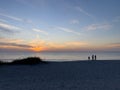 A view of a Sunset on the beach at Siesta Key, Florida with a blue cloudy sky Royalty Free Stock Photo