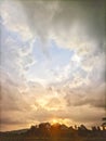 the view of the sunset behind the mountain with beautiful thick clouds Royalty Free Stock Photo