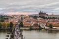 View at sunset from Old Town Bridge tower over the historical Charles bridge, Castle district and St. Vitus Cathedral, Prague, Cze Royalty Free Stock Photo