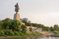 View of the sunset on the promenade and a statue of Lenin in the Krasnoarmeysk district of Vol