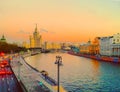 View of the sunset on the river, a residential skyscraper on Kotelnicheskaya Embankment, Moscow River, Bolshoy Ustinsky bridge.