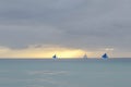 View of sunset in the sea, Boracay beach. 2 sailing boats are in the sea, Royalty Free Stock Photo