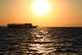 View of the sunset, a ship on the horizon and the waves of the Aegean Sea in the city of Izmir Royalty Free Stock Photo