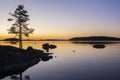 View of the sunset and the shore of The Lake Saimaa in the evening, Lammassaari, Imatra, Finland Royalty Free Stock Photo