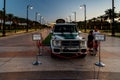 View at sunset to the an old police jeep stands on a decoratively decorated alley in front of the Zaabeel Palace in the Dubai city