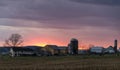 View of a Sunset, Trying to Break Thru Clouds, With Multiple Cloud Layers, and Red Sun Royalty Free Stock Photo