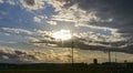 View of a Sunset, Trying to Break Thru Clouds, With Multiple Cloud Layers, and Red Sun Royalty Free Stock Photo