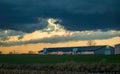 View of a Sunset, Trying to Break Thru Clouds, With Multiple Cloud Layers, and Red Sun Royalty Free Stock Photo