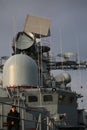 View of the superstructure and radioelectronic armament of a Russian destroyer against the background of a cloudy sky