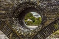 A view through the support of the bridge over the river Teifi at Cenarth, Wales