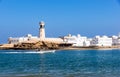 Sur Lighthouse with fisherman boat - Sur, Oman