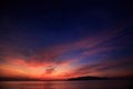 view of surf against fantastic dark blue red sky before sunrise Royalty Free Stock Photo