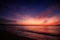 view of surf against fantastic dark blue red sky before sunrise Royalty Free Stock Photo