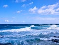 View of a surfer enjoying the strong waves of Hawaiian ocean