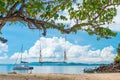 View of a swing against the backdrop of a beautiful sea on a sun Royalty Free Stock Photo