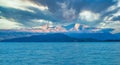 View of the Swiss Alps from the shores of the Upper Zurich Lake Obersee on a cloudy day, Hurden, Schwyz, Switzerland