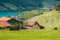 View of swiss village Lungern with traditional houses along the lake Lungerersee, canton of Obwalden, Switzerland Royalty Free Stock Photo