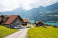 View of swiss village Lungern with traditional houses along the lake Lungerersee, canton of Obwalden, Switzerland Royalty Free Stock Photo