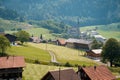 View of swiss village Lungern with traditional houses along the lake Lungerersee, canton of Obwalden, Switzerland