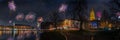 View of Sylvester festive lighting and romantic atmosphere with firework in the Kiel at night. Royalty Free Stock Photo