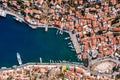 View on Symi Simi island harbor port, classical ship yachts, houses on island hills, Aegean Sea bay. Greece islands holidays
