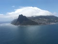 View of table mountain and the lion`s head in the clouds and Cape Town, South Africa.