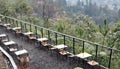 view of tables and chairs lined up next to the mountains Royalty Free Stock Photo