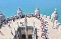 View of Tagus river and Tourists standing in queue inside Belem Tower in Lisbon, Portugal