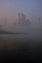 View of Taj Mahal reflected in Yamuna river with early morning fog, Agra, Uttar Pradesh, India