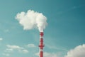 View of a tall chimney with white smoke emission. Pollution of industrial enterprises, exhaust gases of chimneys. Industrial zone Royalty Free Stock Photo