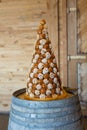 View of a tall croquembouche wedding cake