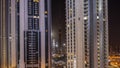 Tallest skyscrapers in downtown dubai located on bouleward street near shopping mall aerial all night timelapse. Royalty Free Stock Photo