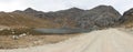 View of the Tecllo Lagoon, the mountains and the road in the morning, located in the province of Yungay, Ancash - Peru