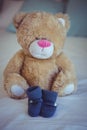 View of teddy bear and baby socks Royalty Free Stock Photo