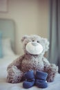 View of teddy bear and baby socks Royalty Free Stock Photo