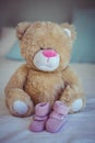 View of teddy bear and baby socks Royalty Free Stock Photo