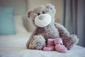 View of teddy bear and baby socks Royalty Free Stock Photo