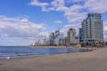 The view of Tel Aviv Bugrashov sandy beach with the Mediterranean sea coastline, and resort hotels Royalty Free Stock Photo