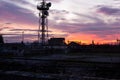 Telecommunication tower Antenna and satellite dish at sunset sky Royalty Free Stock Photo