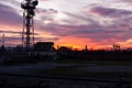 Telecommunication tower Antenna and satellite dish at sunset sky Royalty Free Stock Photo