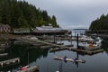 View of telegraph cove on a cloudy morning with Kayakers in forground